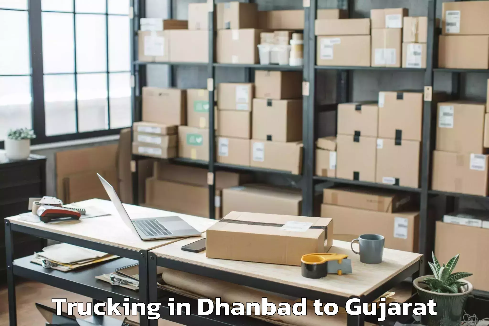 Book Dhanbad to Ganpat University Mehsana Trucking